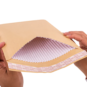 Corrugated envelope with protective kraft paper lining