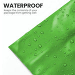 Close-up of a green mailing bag with water droplets showing its moisture-resistant design.