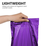 Hand holding a purple lightweight self-seal mailing bag used for postage and courier packaging.