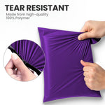 Hands stretching a purple tear-resistant mailing bag made from strong polymer to show its durable design.